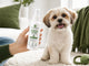 FreshPaws bottle held beside a small dog for scale